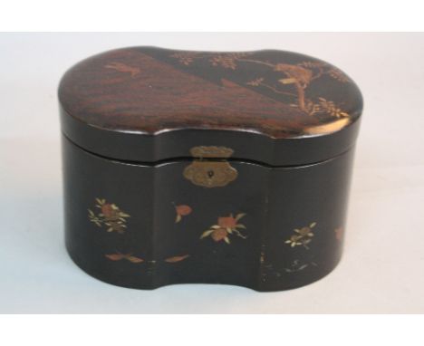 A LATE 19TH CENTURY JAPANESE BLACK LACQUERED TWO DIVISION TEA CADDY, shaped oval outline, decorated with a bird in a branch t