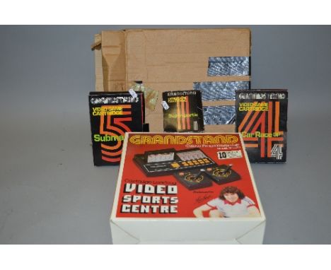 A VINTAGE GRANDSTAND VIDEO GAMING CONSOLE, in its original box and outer with three games, Submarine, Supersportic and Car Ra