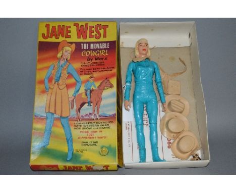 A BOXED MARX JANE WEST COWGIRL, No.2066, from the Johnny West series, complete with some of the accessories including purse, 