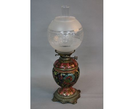 A LATE VICTORIAN MESSENGERS NO.2 BRASS AND CERAMIC OIL LAMP, the spherical globe above reservoir and base printed and painted