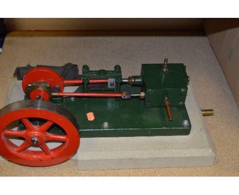 A HORIZONTAL SINGLE CYLINDER LIVE STEAM STATIONARY ENGINE, not tested, no makers markings, diameter of flywheel approximately