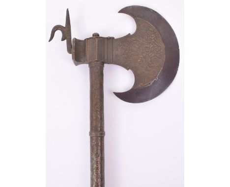 Good Early 19th Century Indian Axe, possibly from Bhuj, iron crescent shaped head with brass sides nicely engraved with scrol