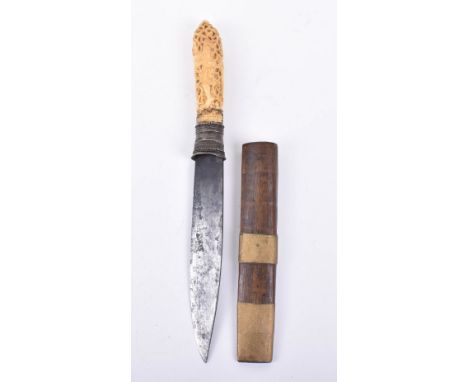 Burmese Dagger Dha, 19th century, slightly swollen single edge blade, ivory hilt well carved with a demonic figure devouring 