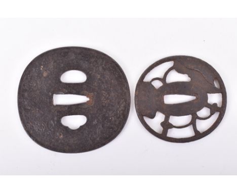 Large Iron Tsuba, chiselled with a dragon in clouds above waves in low relief, a few tiny gold inlaid details, signed; and an
