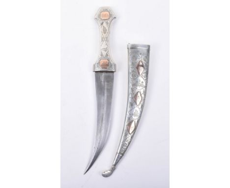 Iraqi Dagger Jambya, curved double edge blade with raised central rib, silver hilt and sheath applied with 5 shaped gold labe