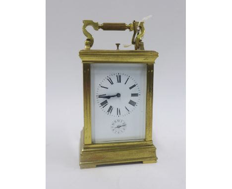 French brass and glass panelled repeater carriage clock, striking on a gong, 19cm high 