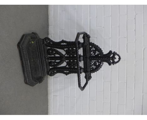 Black painted cast iron stick stand with two divisions, 55 x 83 x 23cm 