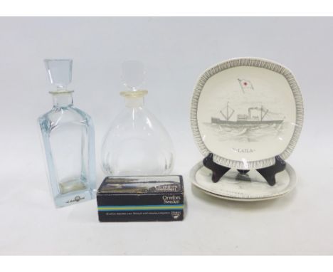 Swedish glass to include an Orrefors pair of glass taper candlestick holders and a clear glass decanter and stopper, a Stromb