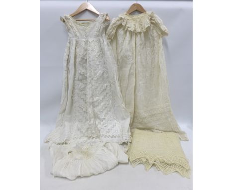 A collection of three vintage christening gowns and a hand knitted shawl (4) 