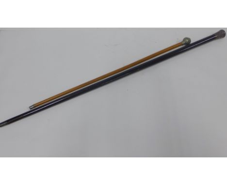 Early 20th century walking cane with a white metal handle dated 1917 and a Royal Scots swagger stick, (2) 