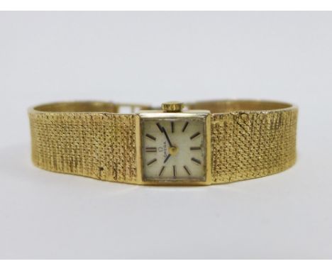 Lady's vintage 9ct gold Omega wristwatch on a 9ct gold textured bracelet strap, with Omega watch box 