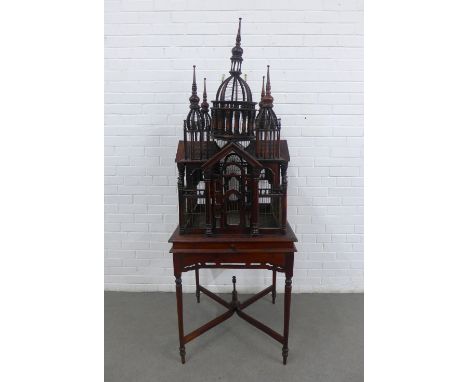 Victorian style architectural birdcage on a square top table with cross stretcher, height overall 67 x 95 x 67cm 