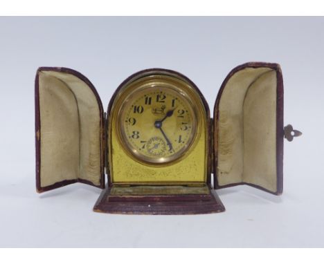 Miniature French gilt metal travelling alarm clock with a leather case, 8cm high 