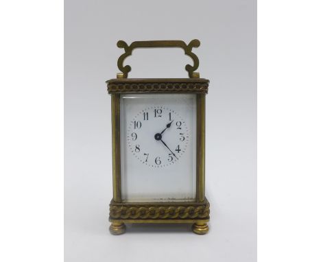 Edwardian brass cased carriage clock with a French movement, 16cm high including handle 