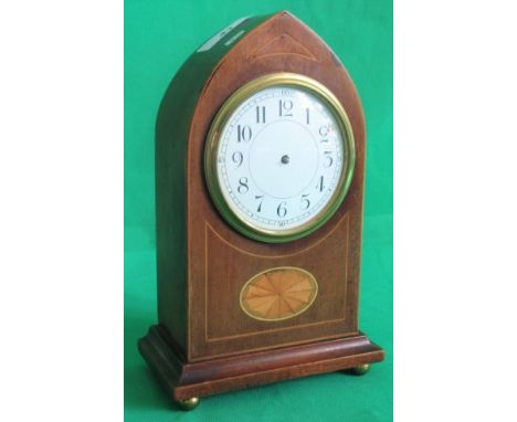 An Edwardian mahogany and shell inlaid mantle clock.