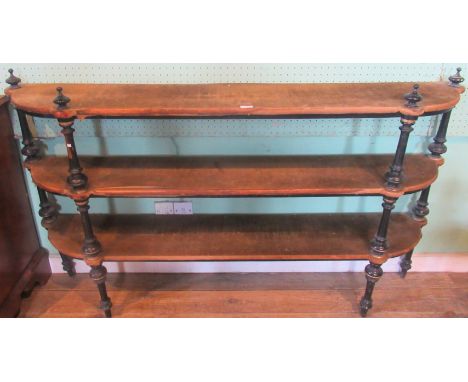 A Victorian ebonised and gilt decorated three tier D-end buffet.