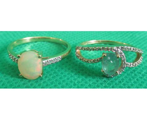 An opal ring in 9ct mount, together with an emerald set ring.