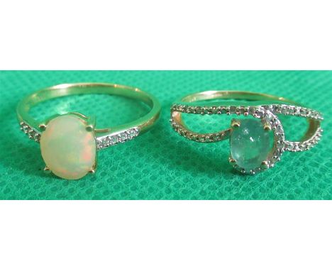 An opal ring in 9ct mount, together with an emerald set ring.