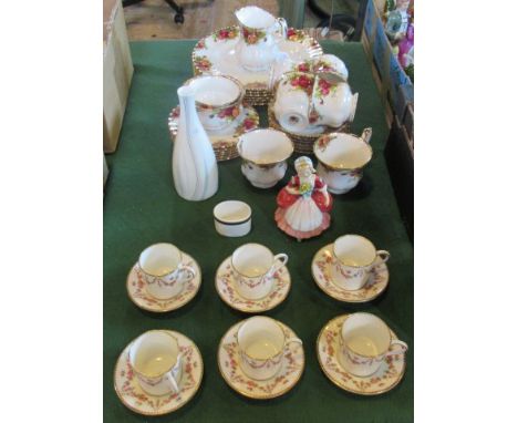 A quantity of Country Roses tea service, together with a Royal Doulton figurine Valerie and six crescent ware decorated coffe