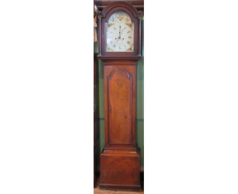 A 19th century mahogany longcase clock, with painted arched dial and Roman numerals, bearing the name Thomas Cragg, Horsham.