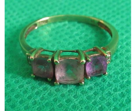 An amethyst and diamond half-hoop ring.