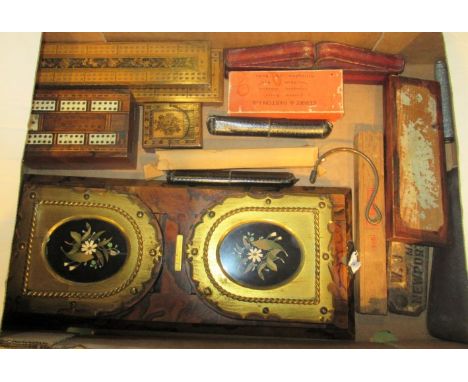 A box containing a quantity of miscellaneous items, to include: a walnut and brass book rack, cribbage boards, various drawin