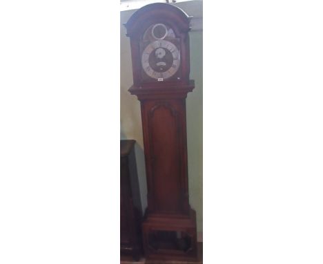 A 19th century mahogany longcase clock, the arch brass dial having Roman numerals and bearing the name Thomas Pritchard, Ampt