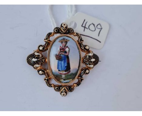 A gold and enamel porcelain panel brooch of a Dutch girl 