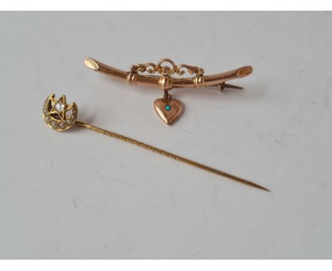 A heart drop brooch in 9ct together with a diamond stick pin 