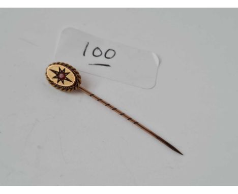 A garnet 9ct stick pin