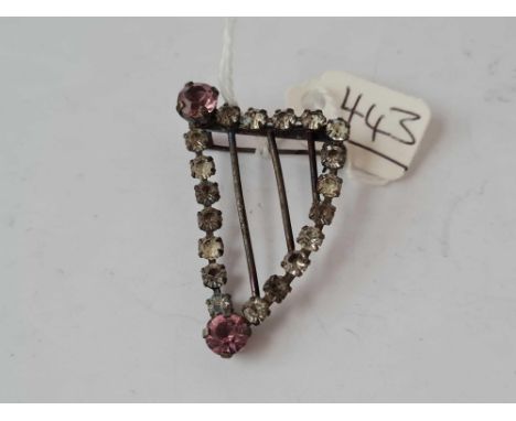 A paste harp shaped brooch 