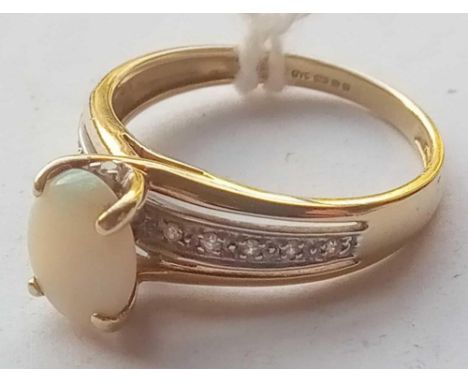 An opal and diamond ring bearing full hall marks in 9ct size R 3g inc