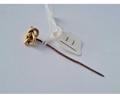 A knot terminal stick pin 15ct gold 