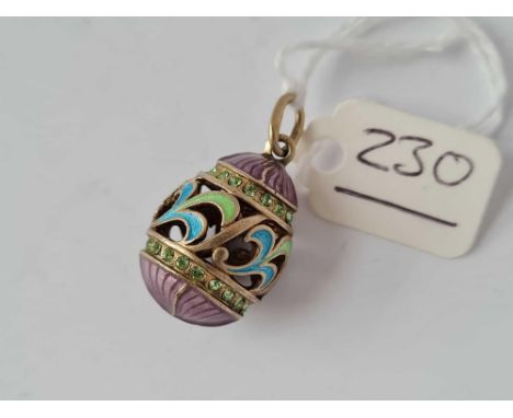 A pretty solid silver coloured enamel Russian egg pendant 