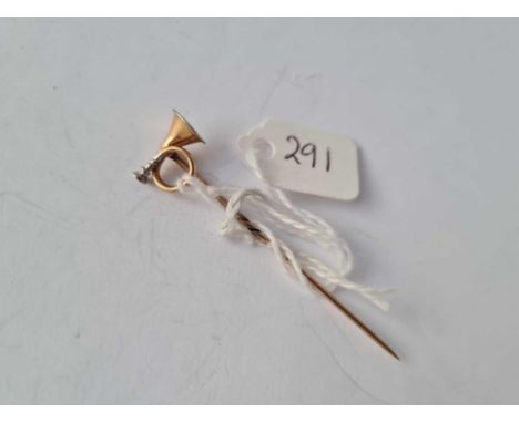 A gold hunting horn stick pin 