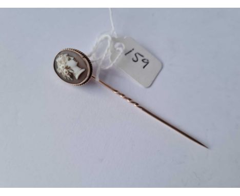 A gold cameo stick pin