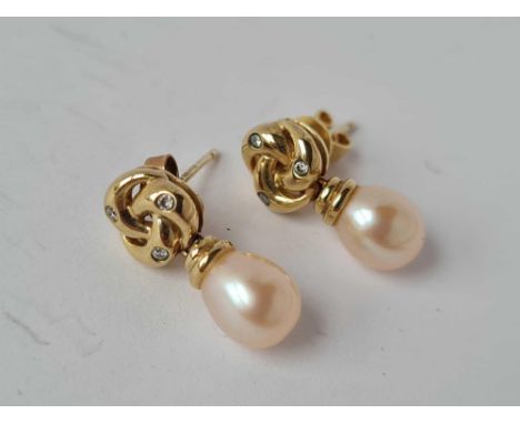 A pair of diamond and pearl earrings 9ct 