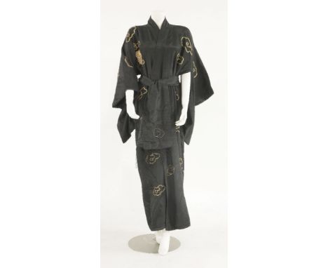 A vintage oriental black silk kimono,c.1930, embroidered in gold metallic thread of dragons amongst swirling clouds