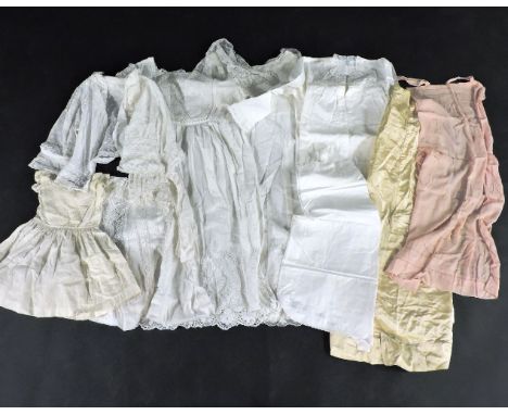 A collection of vintage textiles, to include a cotton lawn jacket with lace insert, a christening gown with appliqué cording 