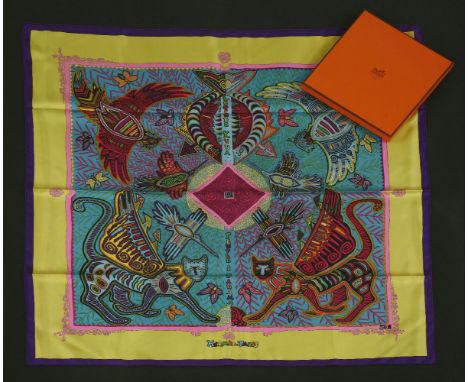 An Hermès silk scarf,'Legende Kuna Peuple de Panama', designed by Zoe Pauwels, purple and yellow border with multicoloured ab