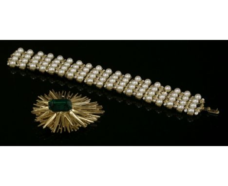 A Trifari bracelet, c.1955-1965,with rows of faux pearls between textured ridged links set with colourless paste gemstones,to