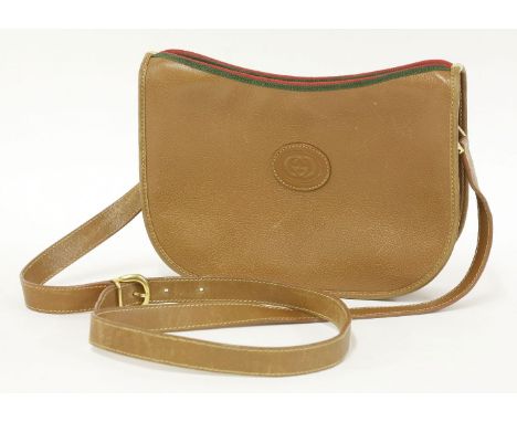 A Gucci vintage brown leather handbag,with oval embossed emblem to front, red and green binding to zip, gold-tone handle and 