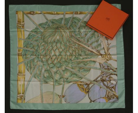 An Hermès silk scarf,'Jardin Creole', designed by Valene Dawlet-Dumoulin, pale green ground with a floral vegetation design, 
