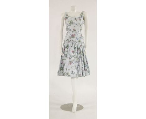 A Horrockses pale blue dress,with floral print, a grey day dress,with pink, green and white floral pattern, with pleated neck