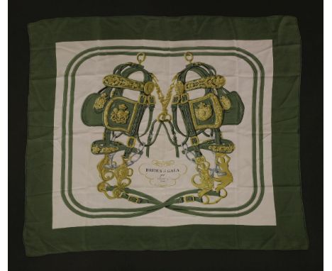 An Hermès Vintage silk scarf,'Brides de Gala', designed by Hugo Grygkar, cream ground with a green border and printed equestr