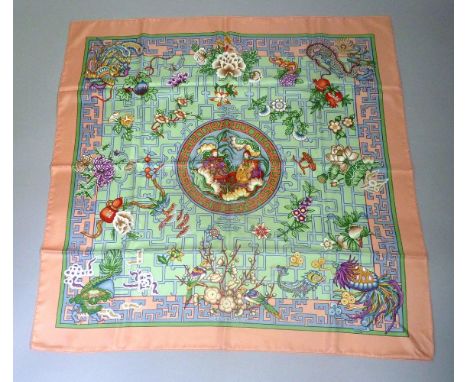 An Hermès silk scarf,'Turandot', designed by Natsuno Hidaka, peach ground with printed oriental design
