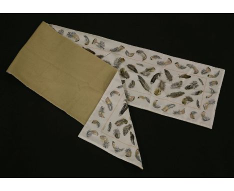 An Hermès silk and angora scarf, the white ground silk printed with feathers, with reverse angora lining, in original box