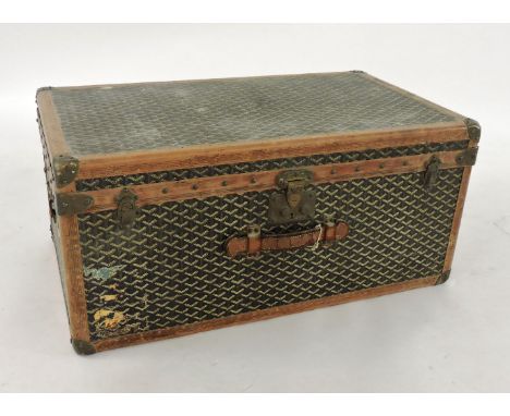 An early 20th century steamer trunk by Goyard, Paris, monogrammed canvas with reinforced leather seams and corners, and brass