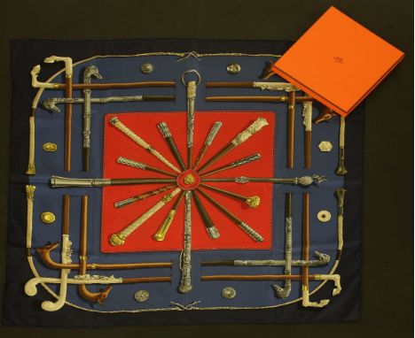 An Hermès silk scarf,'Lannes et Pommeaux' by Françoise de la Perrière, navy ground with red central panel, printed with walki