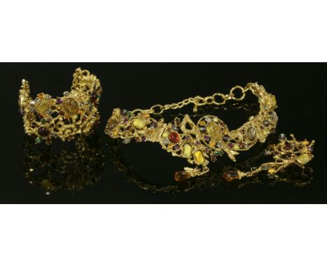 A vintage Christian Lacroix openwork collar, bracelet, brooch and earring suite,an articulated plaque necklace and bracelet s
